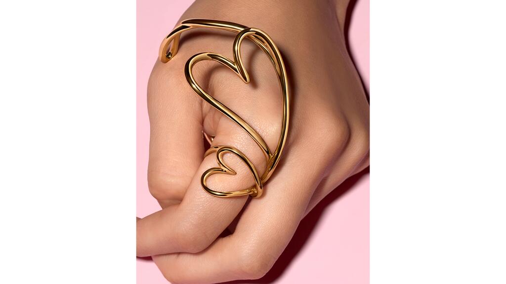 Pandora’s new “Organically Shaped” bangle in plated 14-karat gold ($250) alongside the matching ring ($125) Pandora organically shaped heart bangle and ring